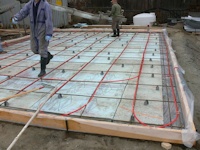 radiant floor heating pipe installed in floor of new shop built by bavariancottages.com